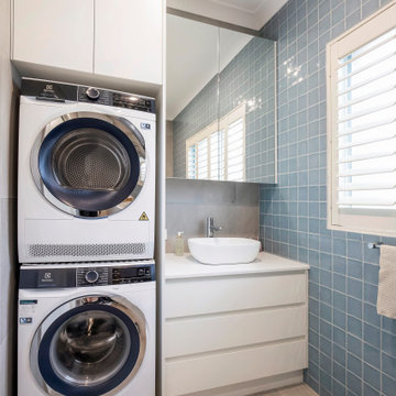 Laundry/ Bathroom with Antaro White Drawers and Pure white Caersarstone