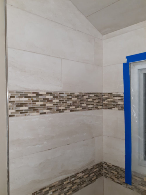 Should I tile up to the ceiling above vanity?