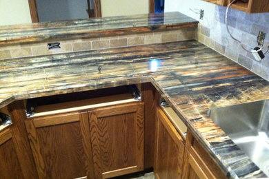 Kitchen - contemporary kitchen idea in Other with recessed-panel cabinets and medium tone wood cabinets