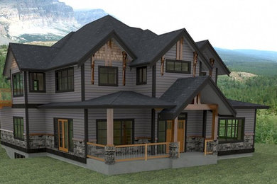 This is an example of a large traditional two-storey grey exterior in Vancouver with mixed siding.