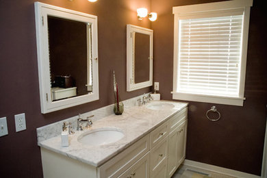 Example of a mid-sized trendy 3/4 bathroom design in Other with shaker cabinets, white cabinets, brown walls, an undermount sink and marble countertops