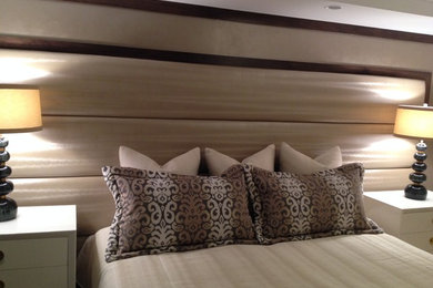 Upholstered wall, custom bedding.  Design by Karen Gomez