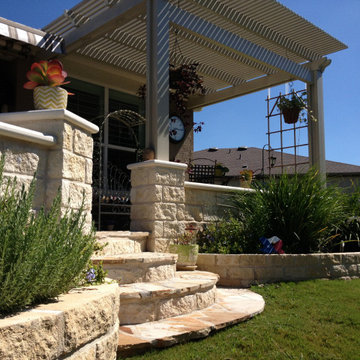 Limestone seatwalls, columns, oklahoma flagstone and Alumawood "diffused" pergol