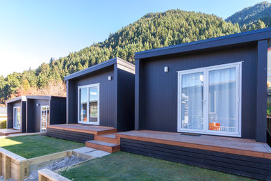 Photo of a small contemporary one-storey black exterior in Dunedin.