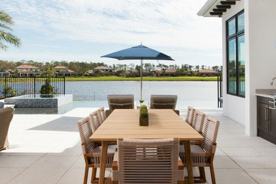 Large beach style dining room in Miami.