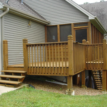 Custom curved, multilevel deck with bar and firepit - Innsbrook, MO