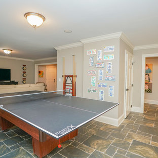 Photo of an expansive victorian walk-out basement in Other with grey walls, ceramic flooring and multi-coloured floors.