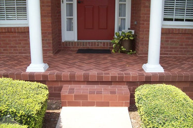 Inspiration for a timeless brick porch remodel in Atlanta