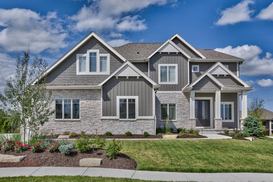 Example of a large gray two-story mixed siding exterior home design in Omaha