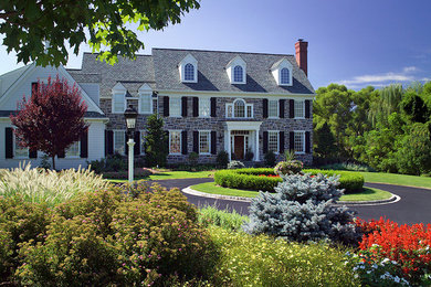 Photo of a mid-sized victorian front yard driveway in Philadelphia.