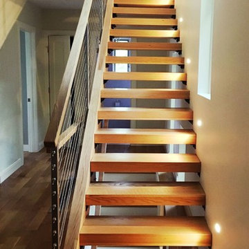 Open-riser stair from upper level Kitchen and Dining