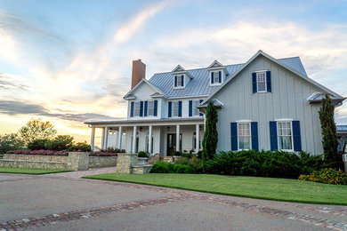 Inspiration for a large shabby-chic style full sun backyard brick landscaping in Houston.