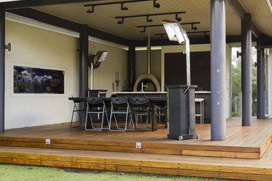 Modern backyard patio in Melbourne with decking.