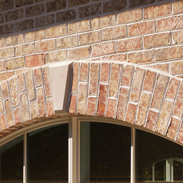 Spalding Tudor Brick Home featuring Sugarcane Brown Stone - South Carolina