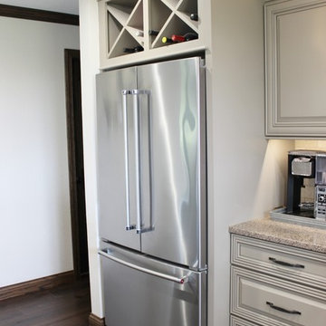 Farmhouse kitchen Taupe Painted Cabinets,Quartz Tops, and Dark Island