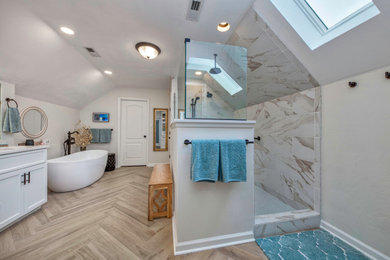 Example of a large minimalist master multicolored tile and ceramic tile ceramic tile, brown floor and double-sink bathroom design in Other with shaker cabinets, white cabinets, a two-piece toilet, white walls, an undermount sink, granite countertops, white countertops, a niche and a built-in vanity