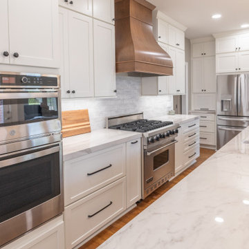 Porcelain Island Kitchen Remodel with Custom Built-Ins + Fireplace Feature