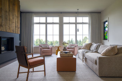 Inspiration for a transitional dark wood floor and brown floor living room remodel in Burlington with beige walls and a standard fireplace