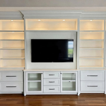 Custom Built-In Media Wall with Glass Display Cabinets