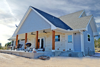 Inspiration for a mid-sized transitional gray one-story wood exterior home remodel in Austin with a shingle roof