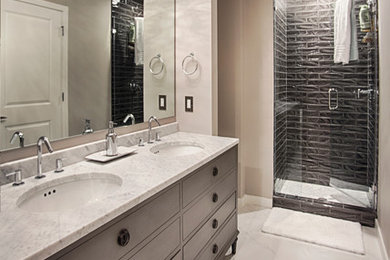 Design ideas for a mid-sized contemporary master bathroom in Nashville with a drop-in sink, furniture-like cabinets, medium wood cabinets, marble benchtops, an alcove tub, a corner shower, a one-piece toilet, black tile, ceramic tile, beige walls and marble floors.
