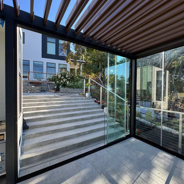 Frameless Sliding Glass Walls for a Panoramic Veranda in California