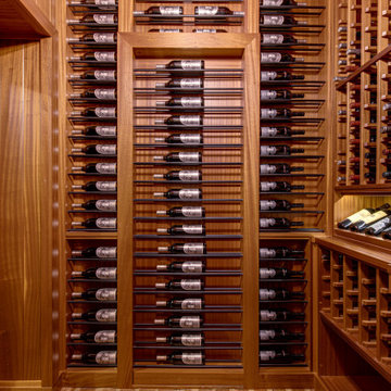 Secret passageway wine cellar. Basement layout with all mahogany racking.