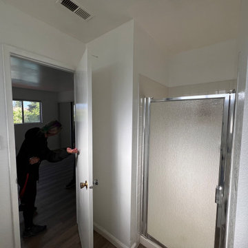 BEFORE! Tiny Shower Enlarged, Hinged Door Changed to a Pocket Door