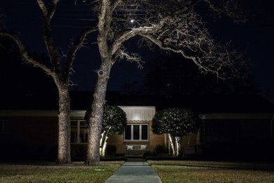 Inspiration for a small traditional partial sun front yard concrete paver driveway in Austin.