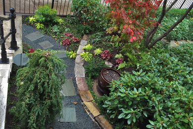 Design ideas for a small transitional front yard shaded garden in Chicago with natural stone pavers.
