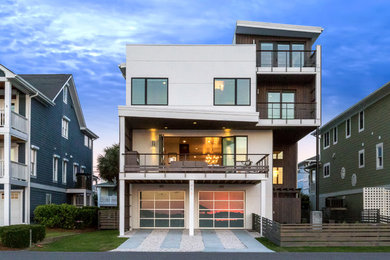 Mid-sized minimalist white three-story concrete fiberboard flat roof photo in Wilmington