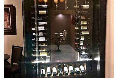 Small elegant wine cellar photo in Orlando