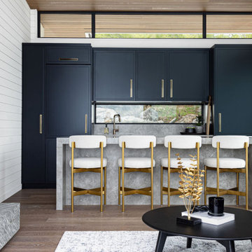 Modern Black Boathouse Kitchen with Waterfall Island