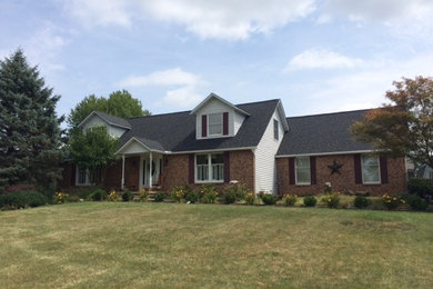 Mid-sized elegant red two-story brick gable roof photo in Columbus