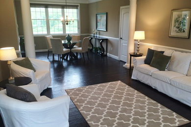 Large transitional formal and open concept dark wood floor living room photo in Detroit with beige walls, no fireplace and no tv