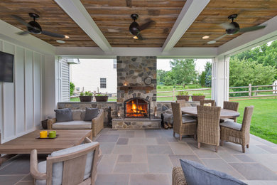 Example of a country patio design in Philadelphia