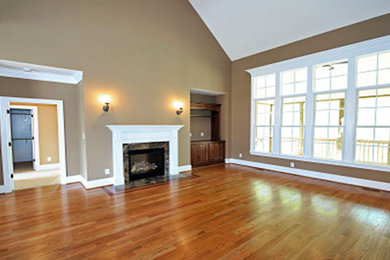 Light wood floor family room photo in Sacramento with beige walls