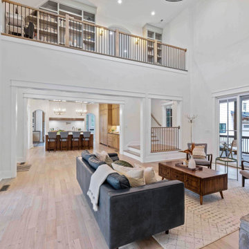 Cozy Modern Farmhouse Living Room: Stone Fireplace, Vaulted Ceilings, Loft Libra