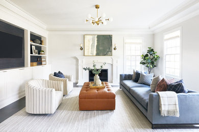 Inspiration for a transitional living room in San Francisco with white walls, dark hardwood floors, a standard fireplace, a wall-mounted tv and grey floor.
