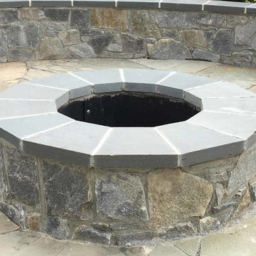 Irregular flagstone patio, stone sitting wall, stone firepit