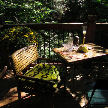 Small deck in the woods set for afternoon tea, and later for cocktails.