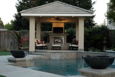 Inspiration for a mid-sized contemporary backyard concrete and custom-shaped hot tub remodel in Other
