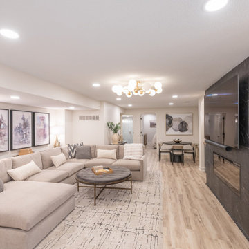 Warm & Inviting Basement Retreat with Custom Bar + Entertainment Center