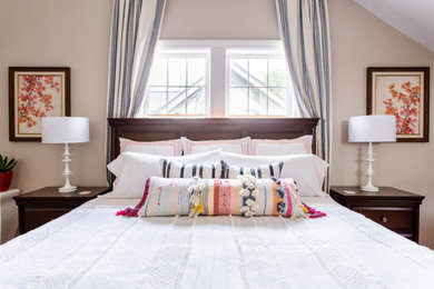 Mid-sized transitional guest bedroom in Nashville with beige walls, medium hardwood floors and orange floor.