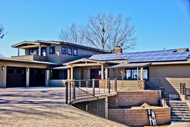 Large two-storey beige exterior in Sacramento with mixed siding.