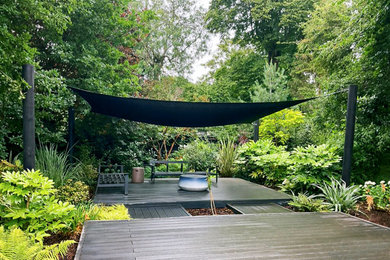 Photo of a large back private terrace in London with a pergola.