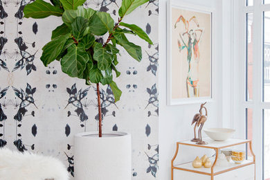 Inspiration for a mid-sized contemporary open concept ceramic tile living room remodel in Vancouver with white walls and a wall-mounted tv