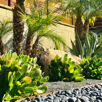 Weathered steel edging separates drought tolerant plantings from heavy Mexican B