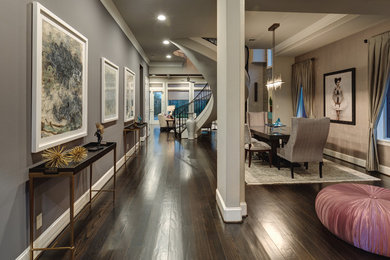 Great room - large eclectic dark wood floor and brown floor great room idea in Houston with gray walls and no fireplace
