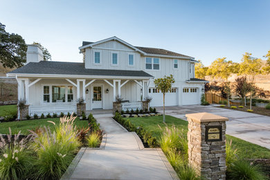 Inspiration for a mid-sized farmhouse white two-story exterior home remodel in San Francisco with a shingle roof